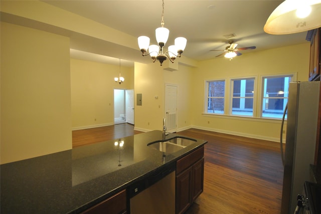 kitchen featuring dishwasher, hanging light fixtures, dark hardwood / wood-style floors, and sink