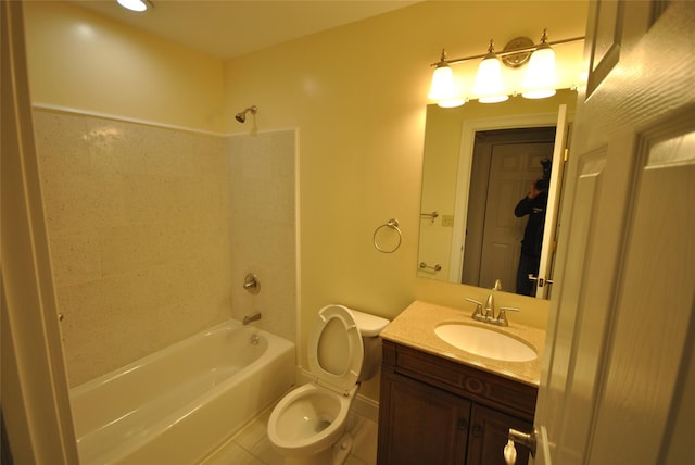 full bathroom with washtub / shower combination, vanity, tile patterned floors, and toilet