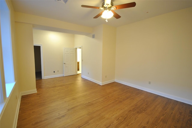 unfurnished room with light hardwood / wood-style flooring and ceiling fan