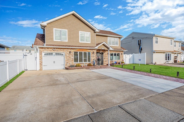 view of front of property with a front yard and a garage