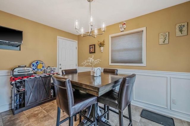 dining area featuring an inviting chandelier