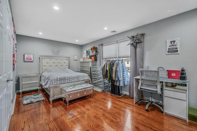 bedroom featuring wood-type flooring