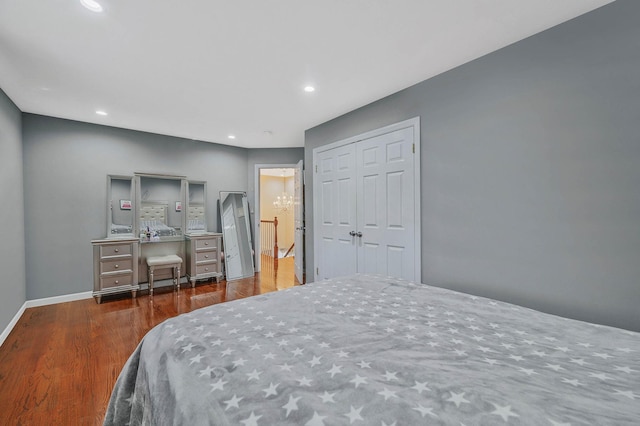 bedroom featuring dark hardwood / wood-style floors and a closet