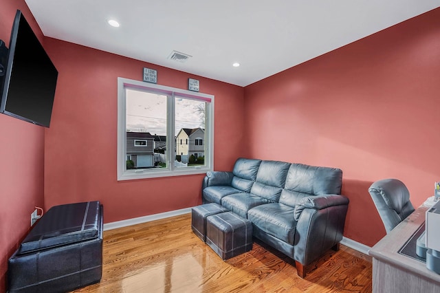 home theater with light wood-type flooring