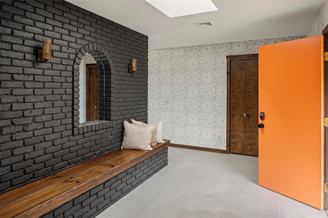 hallway featuring a skylight