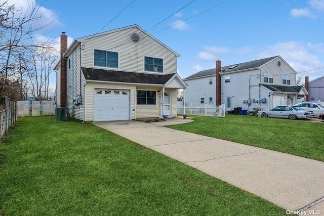 view of front facade with a garage, central air condition unit, and a front lawn