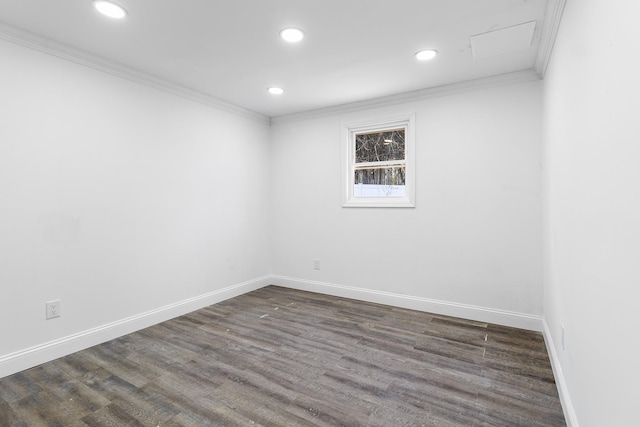 spare room featuring dark hardwood / wood-style flooring and crown molding