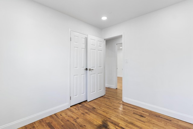 unfurnished bedroom featuring wood-type flooring