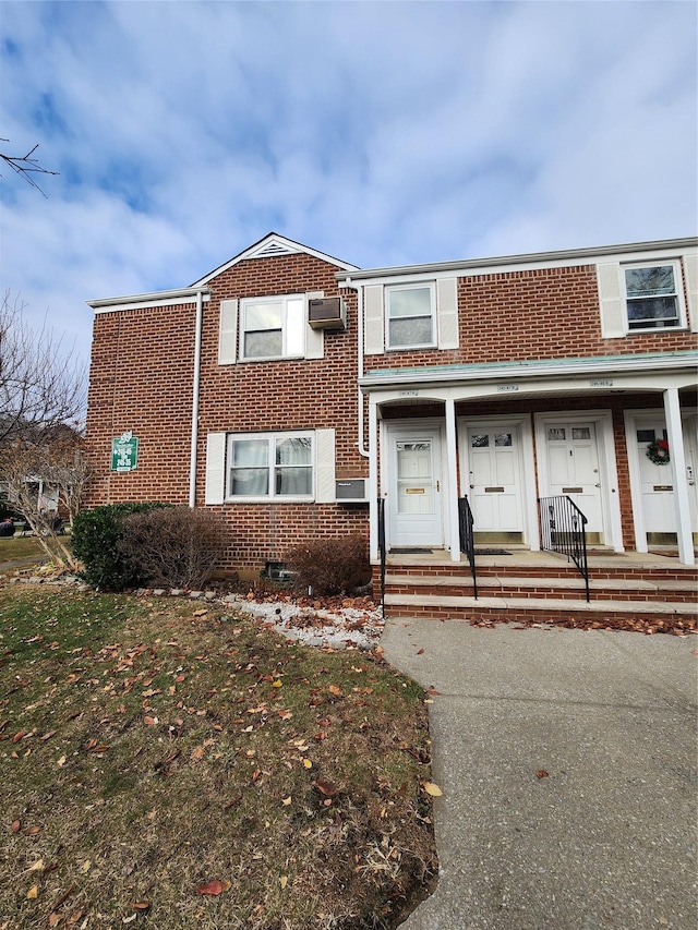 townhome / multi-family property with an AC wall unit