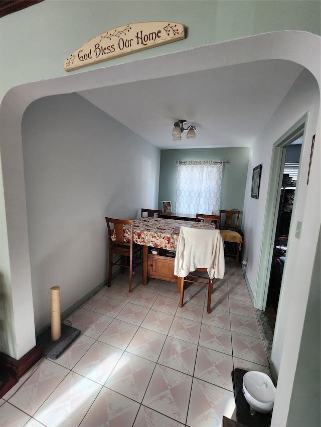 bedroom with light tile patterned floors