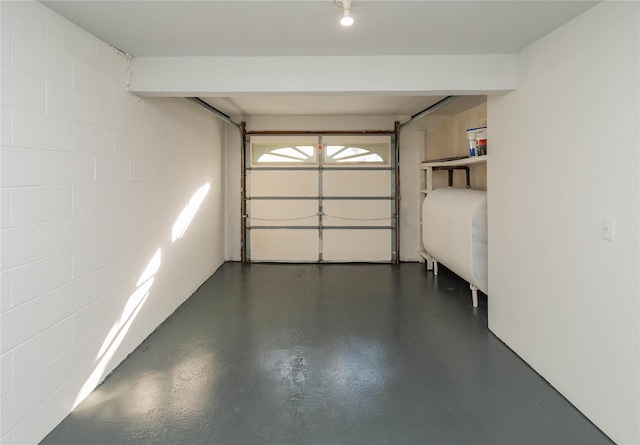 garage with concrete block wall and heating fuel