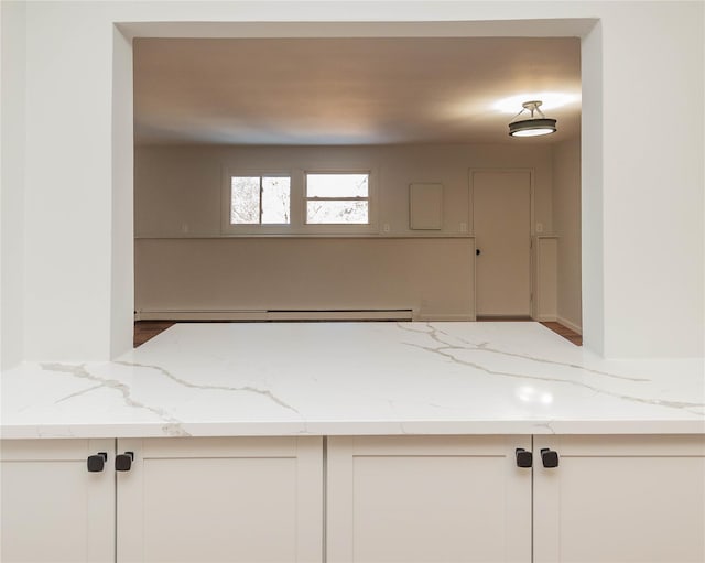 bathroom featuring a baseboard heating unit