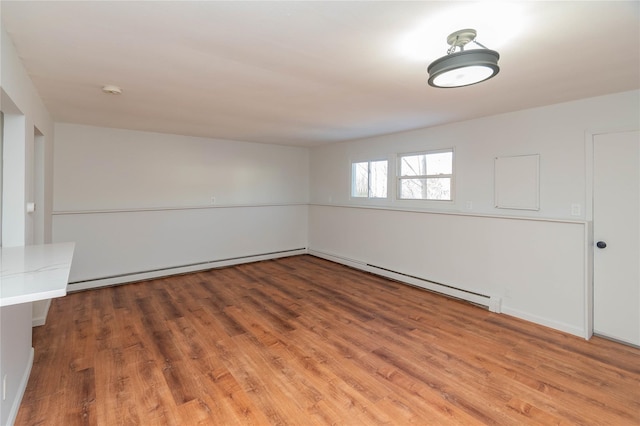 unfurnished room with wood finished floors