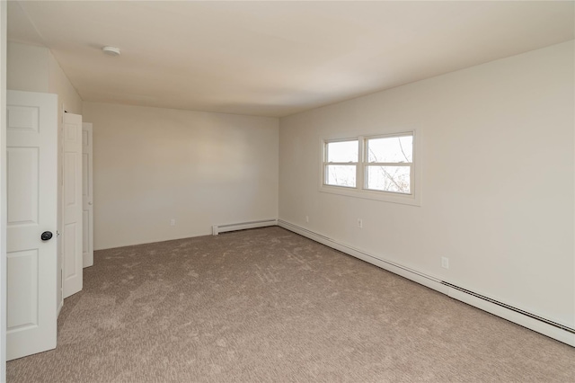 unfurnished room featuring carpet flooring and baseboard heating