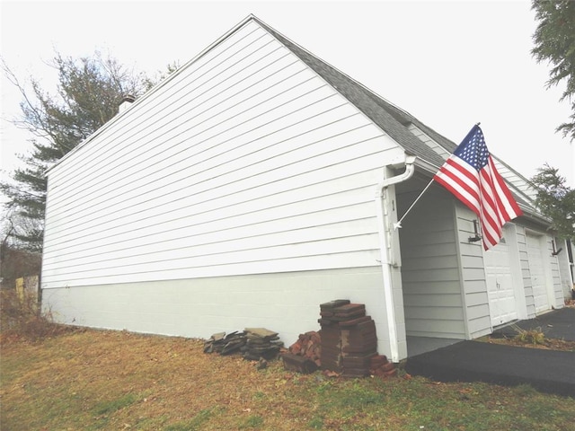 view of property exterior with a garage