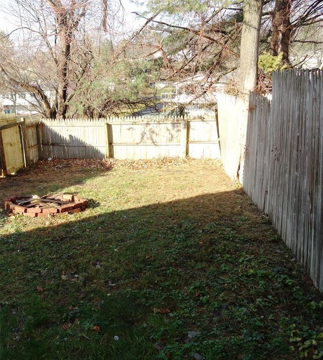 view of yard with a fenced backyard