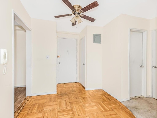 corridor with electric panel and light parquet flooring