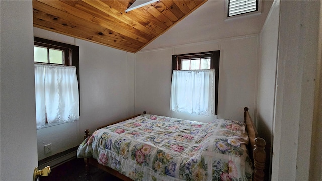 bedroom with multiple windows, wooden ceiling, and vaulted ceiling