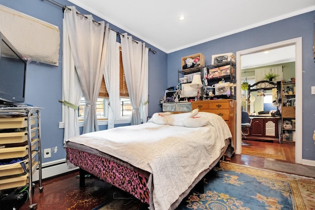 bedroom with dark hardwood / wood-style flooring, crown molding, and a baseboard heating unit