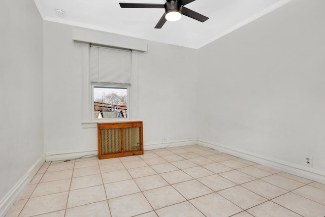 empty room with light tile patterned floors, ceiling fan, and crown molding