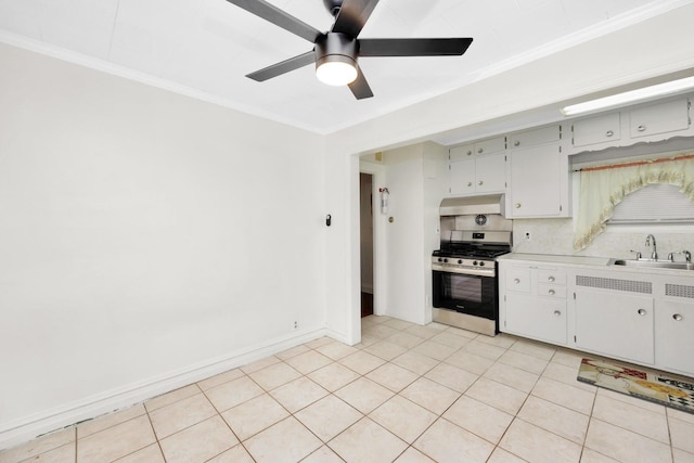 kitchen with tasteful backsplash, sink, light tile patterned floors, stainless steel range with gas stovetop, and range hood