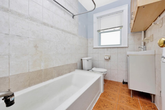 full bathroom featuring vanity,  shower combination, toilet, and tile walls