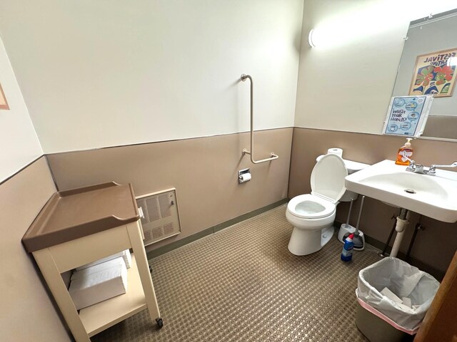 half bath with a sink and toilet