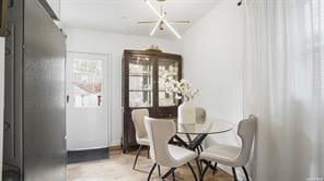 dining space with a notable chandelier