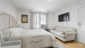 bedroom with wood-type flooring