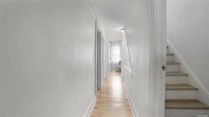 corridor with light wood-type flooring