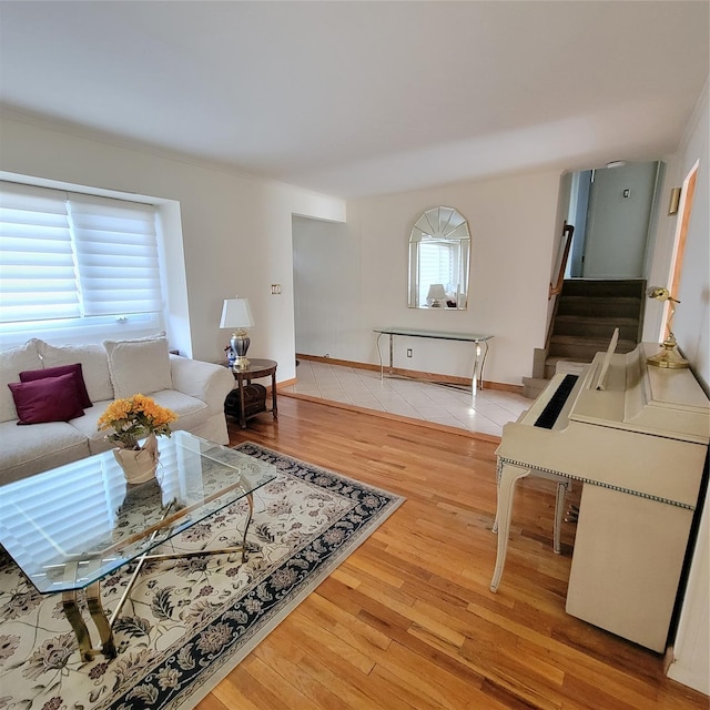 living room with hardwood / wood-style floors and a healthy amount of sunlight