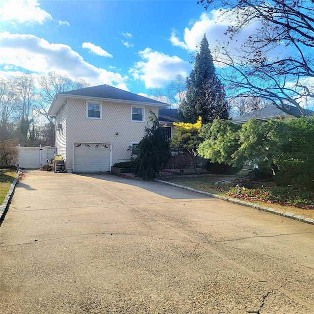 view of side of property with a garage