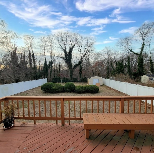 wooden deck with a shed