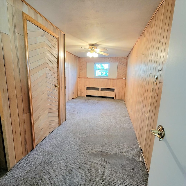 3914 Jerusalem Ave, Seaford, NY 11783 - corridor with wood walls, radiator heating unit, and carpet