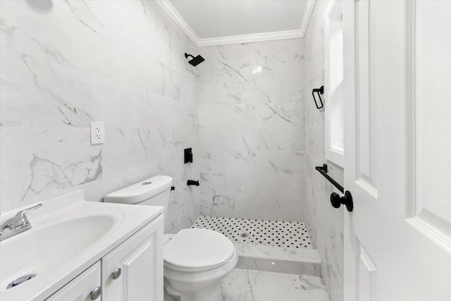 bathroom featuring vanity, crown molding, toilet, tile walls, and a tile shower