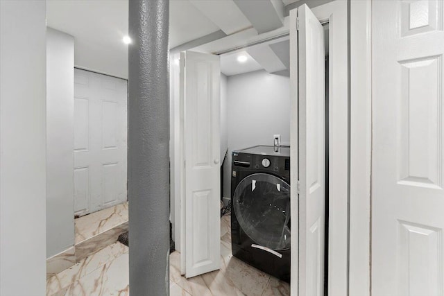 washroom featuring washer / clothes dryer