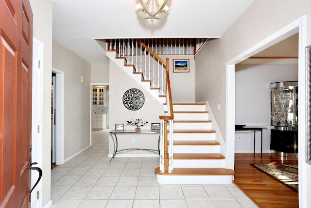 entrance foyer with light tile patterned floors