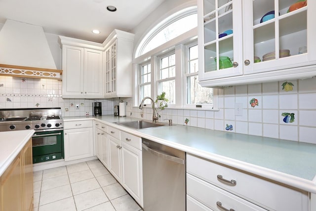 kitchen featuring white cabinets, sink, dishwasher, and range with gas stovetop