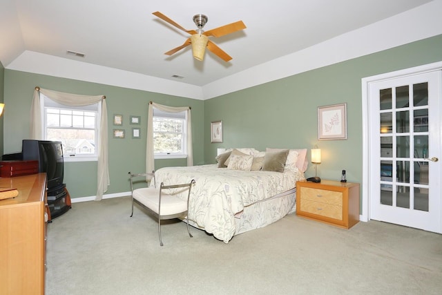 bedroom featuring ceiling fan, vaulted ceiling, and carpet flooring