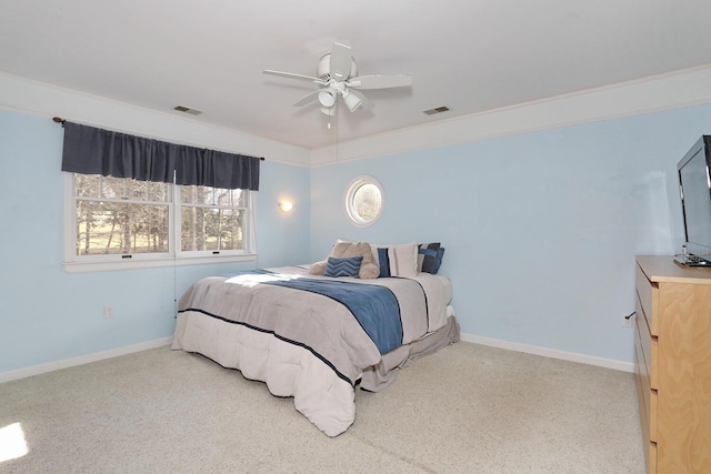 carpeted bedroom with ceiling fan and crown molding