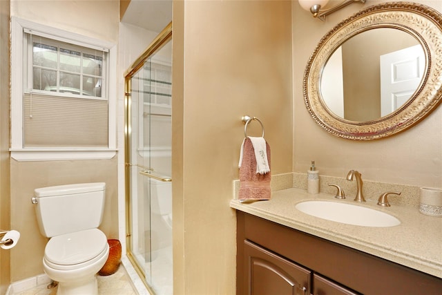 bathroom with walk in shower, vanity, tile patterned floors, and toilet