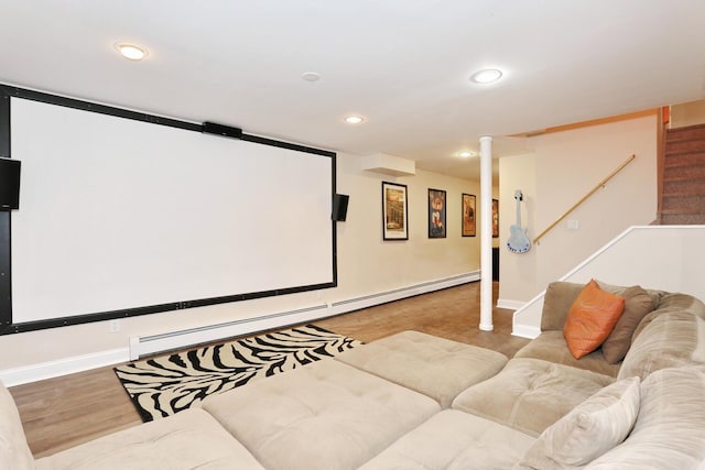 cinema room with a baseboard radiator