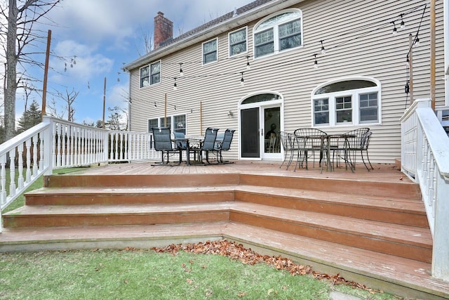 rear view of property with a deck