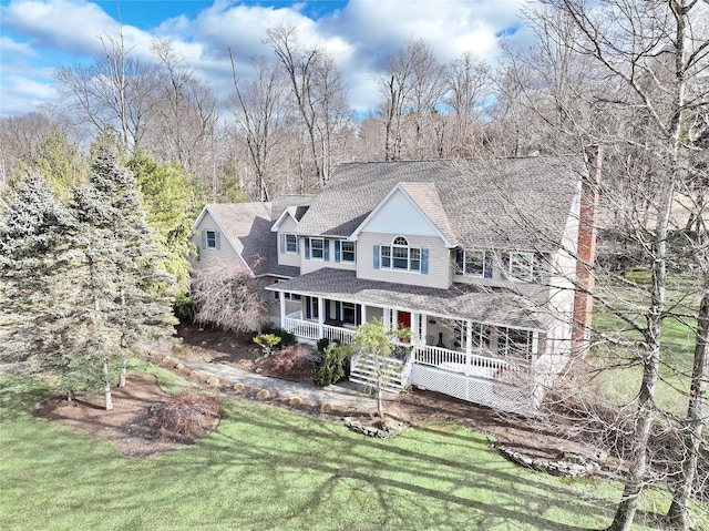 view of front of home with a front lawn and covered porch