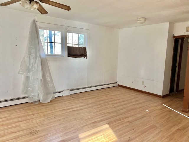 empty room featuring ceiling fan and light wood-type flooring