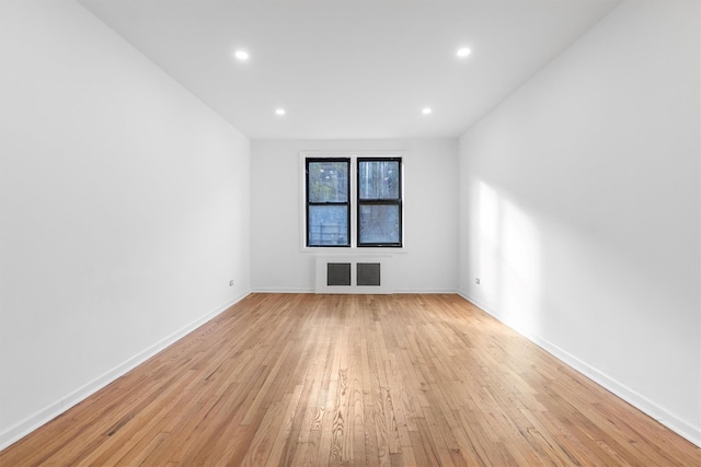 empty room with light hardwood / wood-style floors