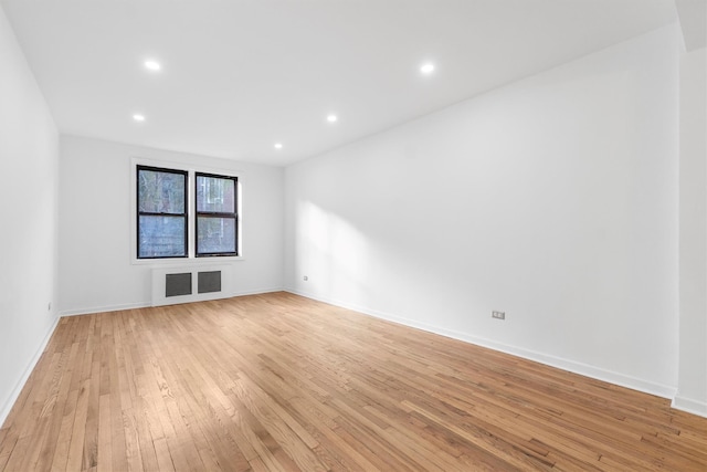 spare room featuring light hardwood / wood-style flooring