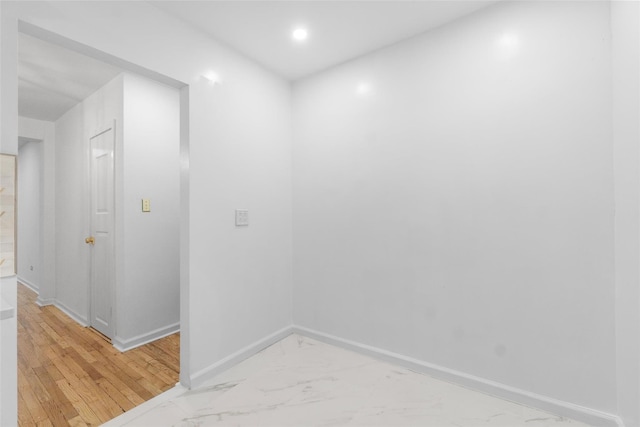 spare room with hardwood / wood-style floors