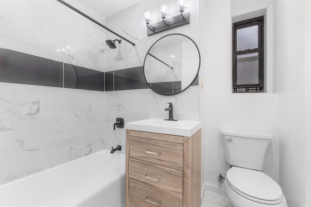 full bathroom with vanity, tiled shower / bath combo, and toilet