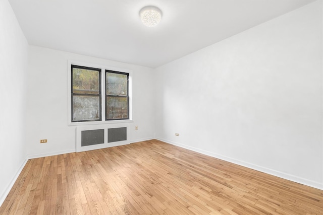 spare room with light hardwood / wood-style floors